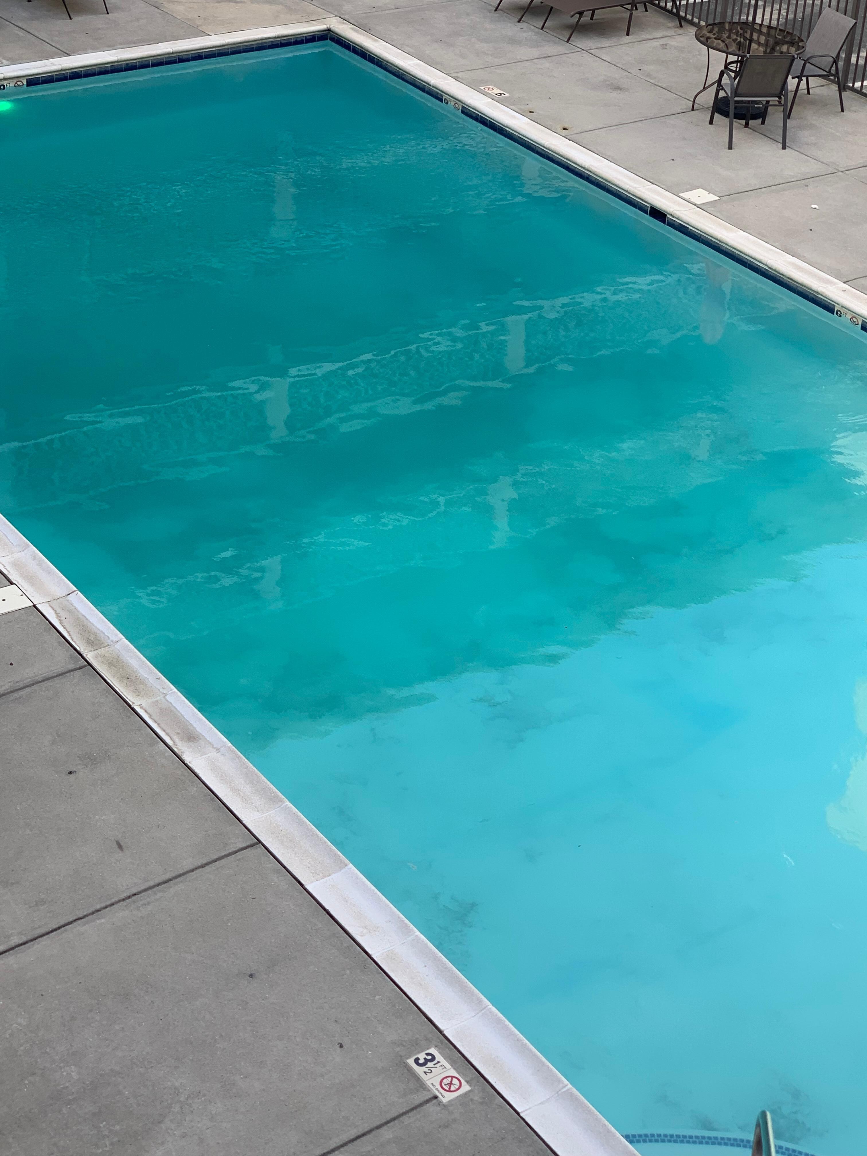 Dark spots sand at the bottom of the pool