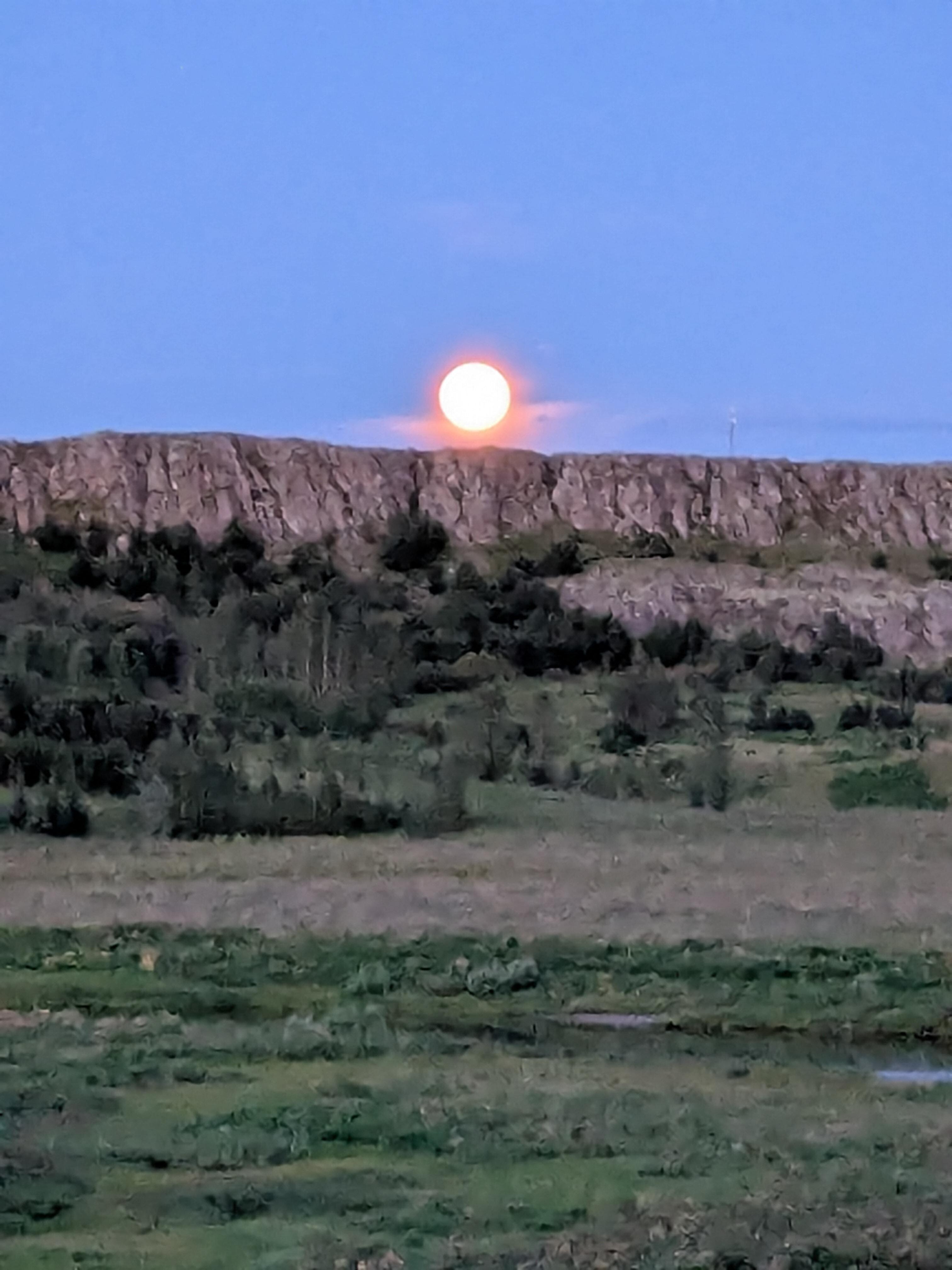 The moon shining so bright at almost midnight.