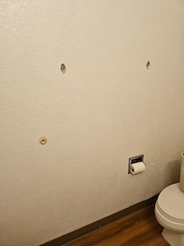 Towel hanger's not there in the restroom.