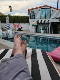 Relaxing by the pool with view of casita