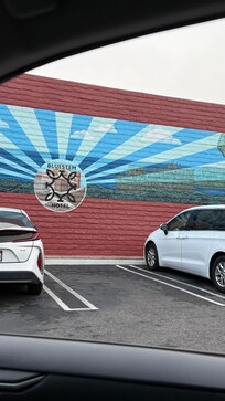 The gated parking lot! Very nice mural!