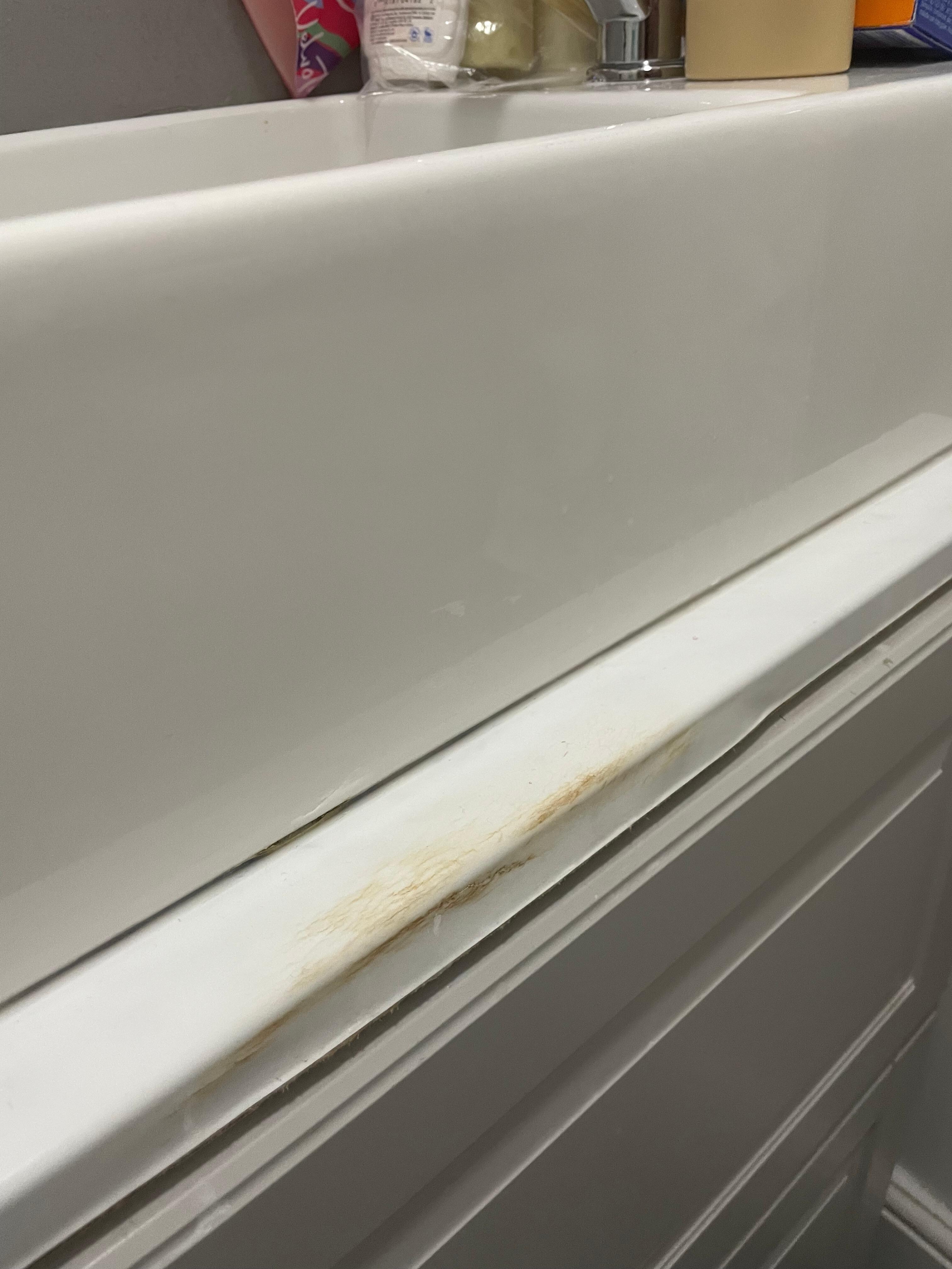 Horrible brown stain at the front of the basin
