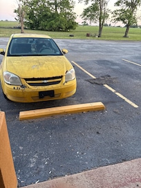 My partner’s car who drove and has a lot of damage from the storm
