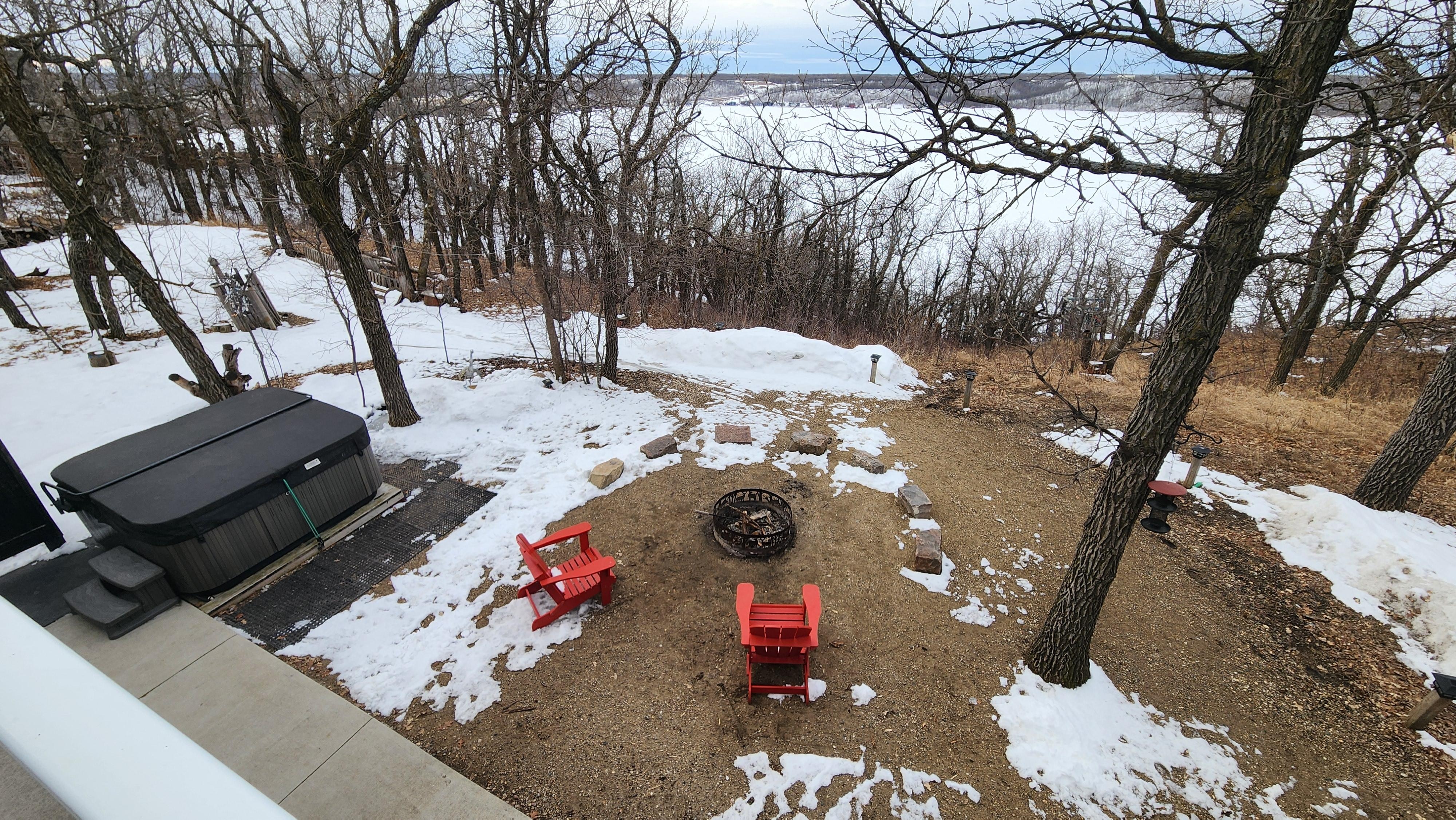 Hot tub and fire pit overlooking the lake
