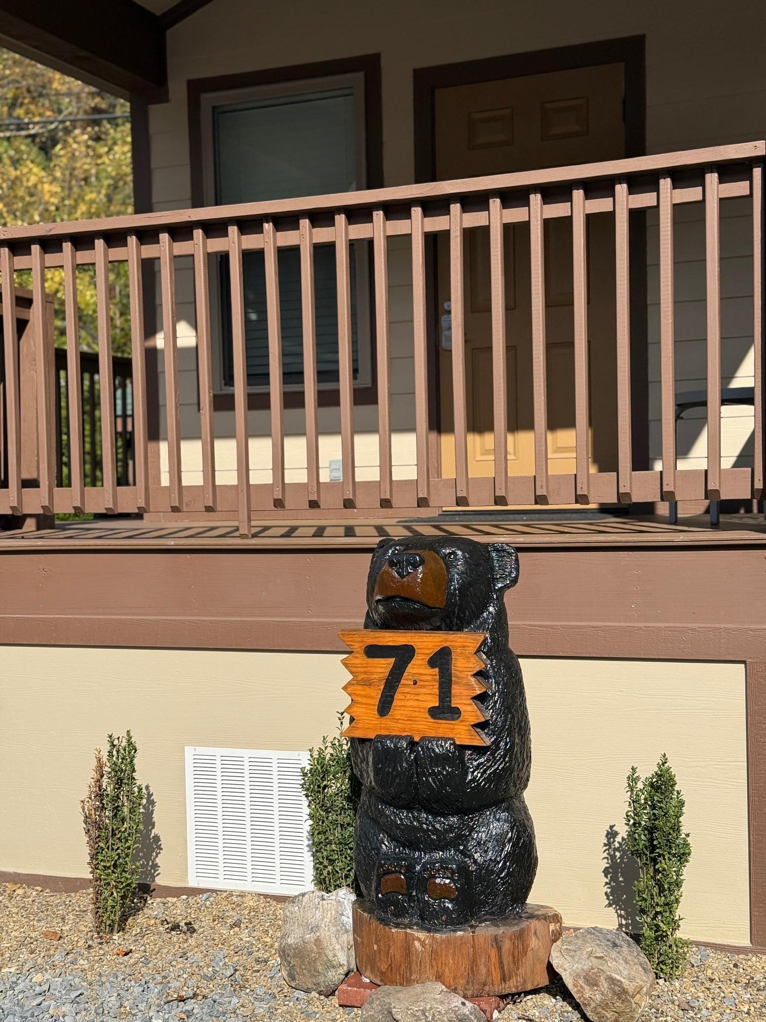 front porch with cute bear-themed signage that matches the rest of the Dudley Creek signage