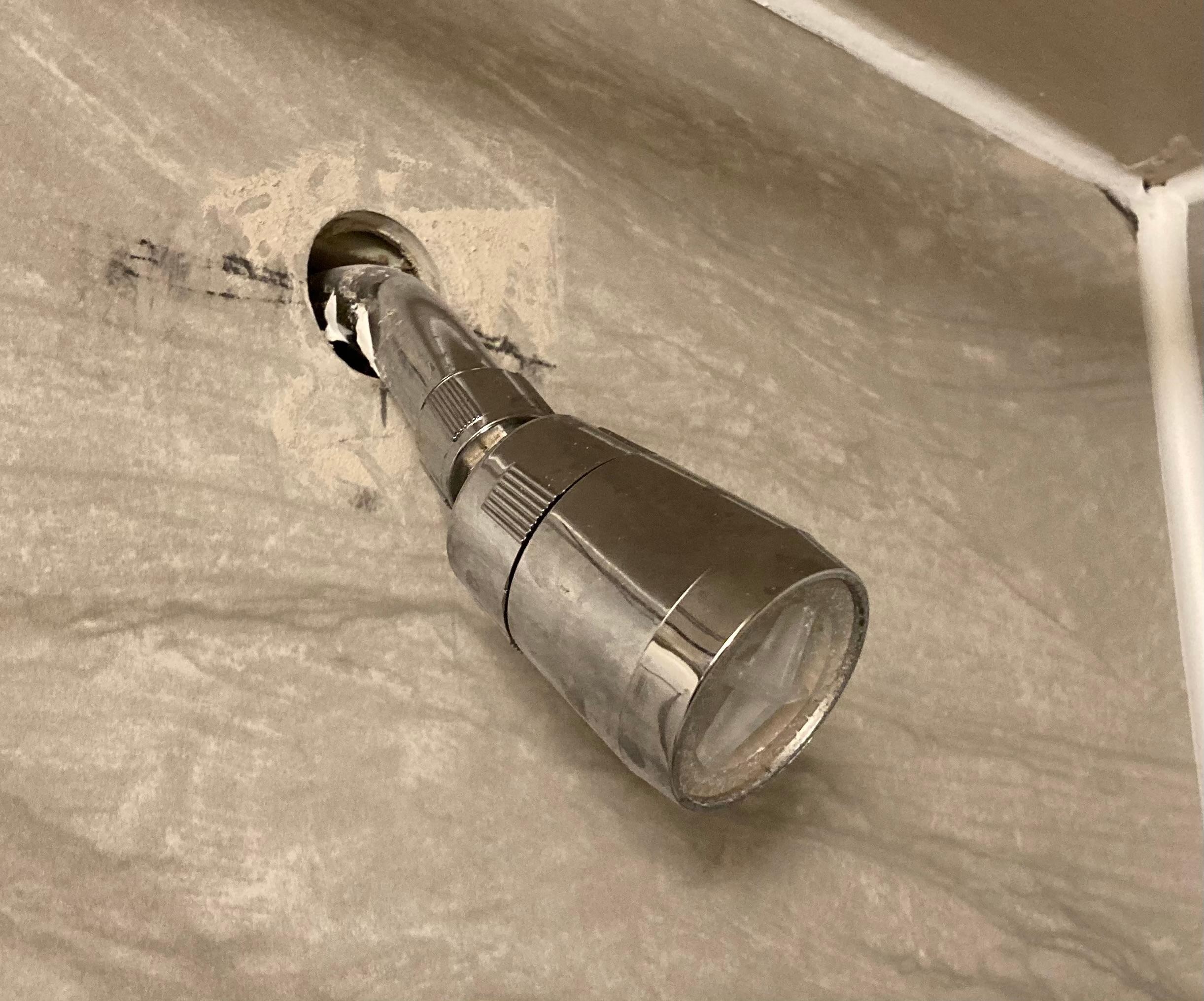 Shower head coming through wall