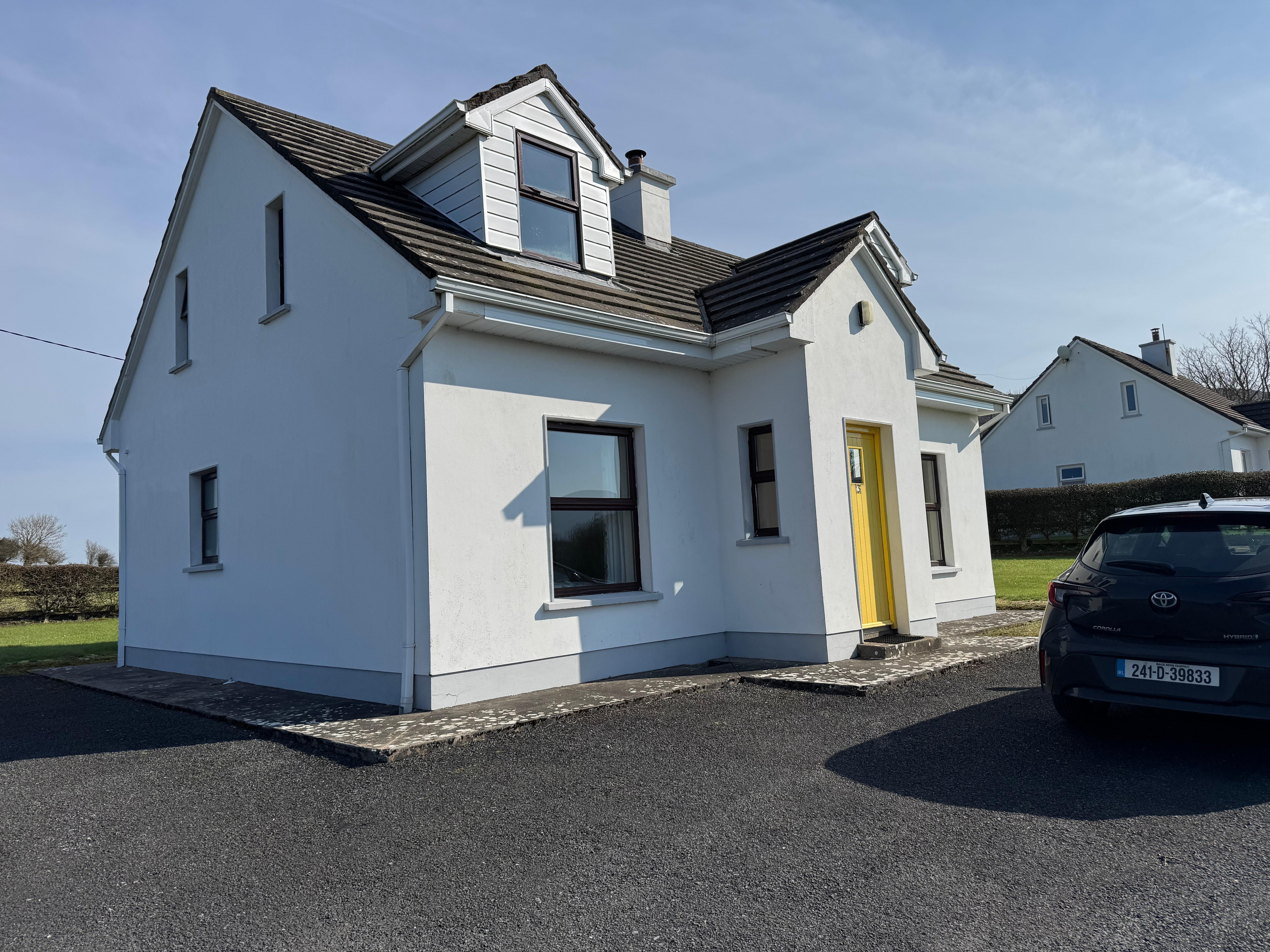 The cottage from the front left.