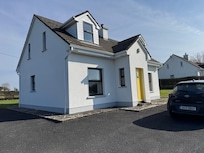 The cottage from the front left.