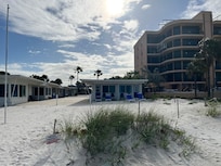 You get one half of the small building on the left. Plenty of room for 2, would be ok for 4