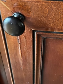 Water leak slowly causing water damage on cabinets