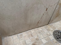 Shower was pooling water and tiles/grout were damaged