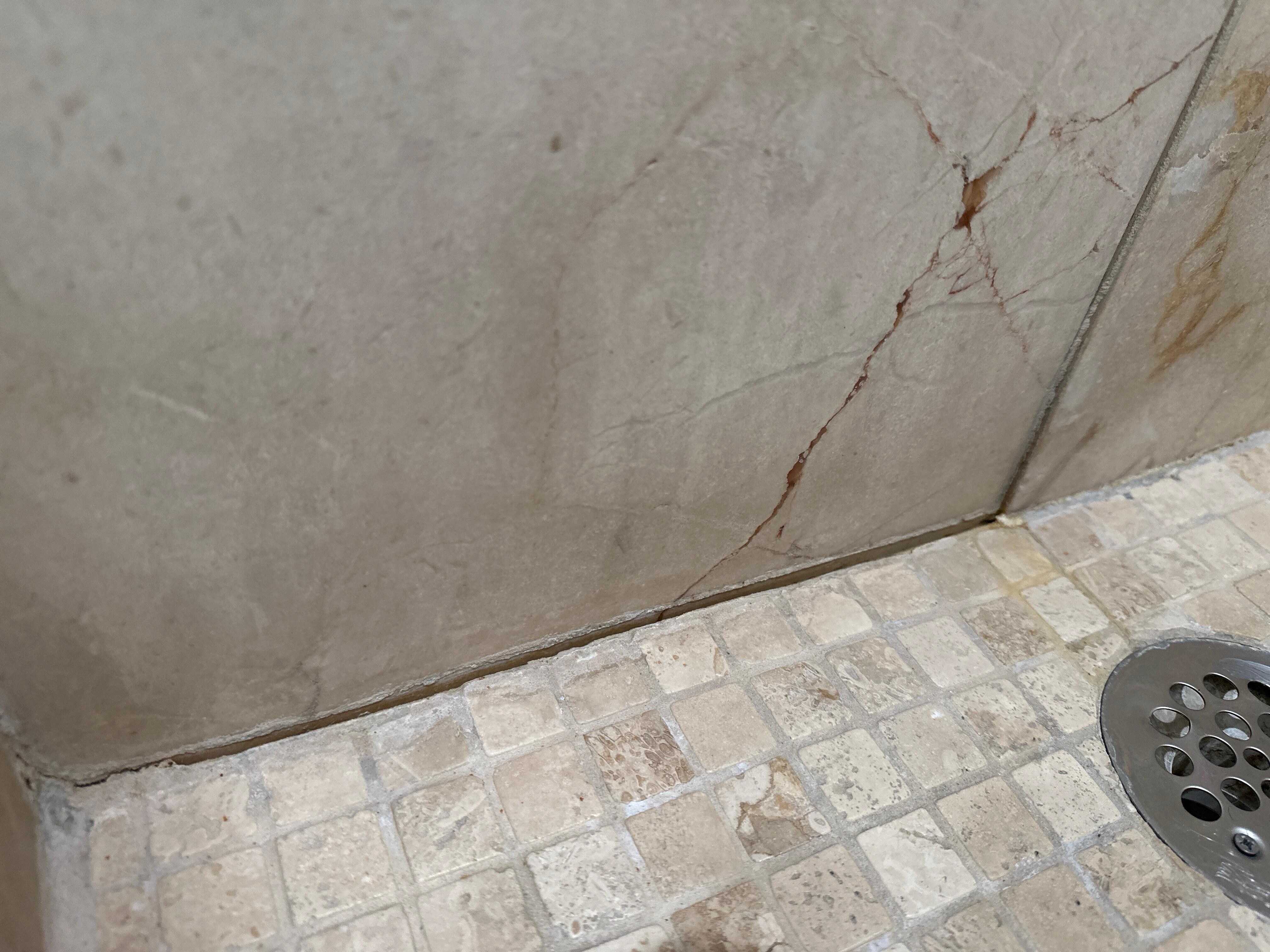 Shower was pooling water and tiles/grout were damaged