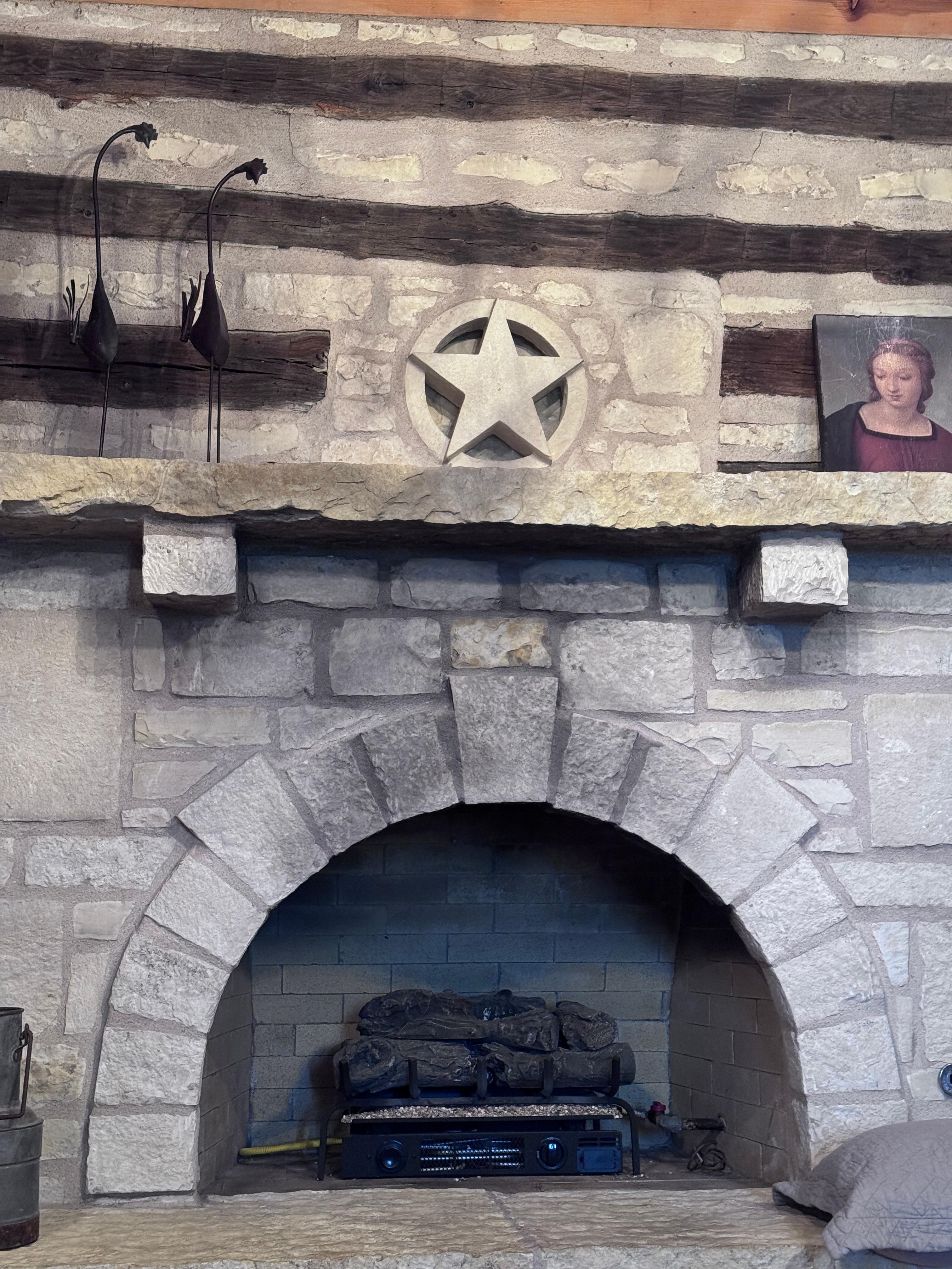 Fireplace is decorative in the warmer months but so charming.