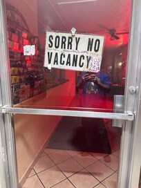 No one in office
Sign on door with no vacancy