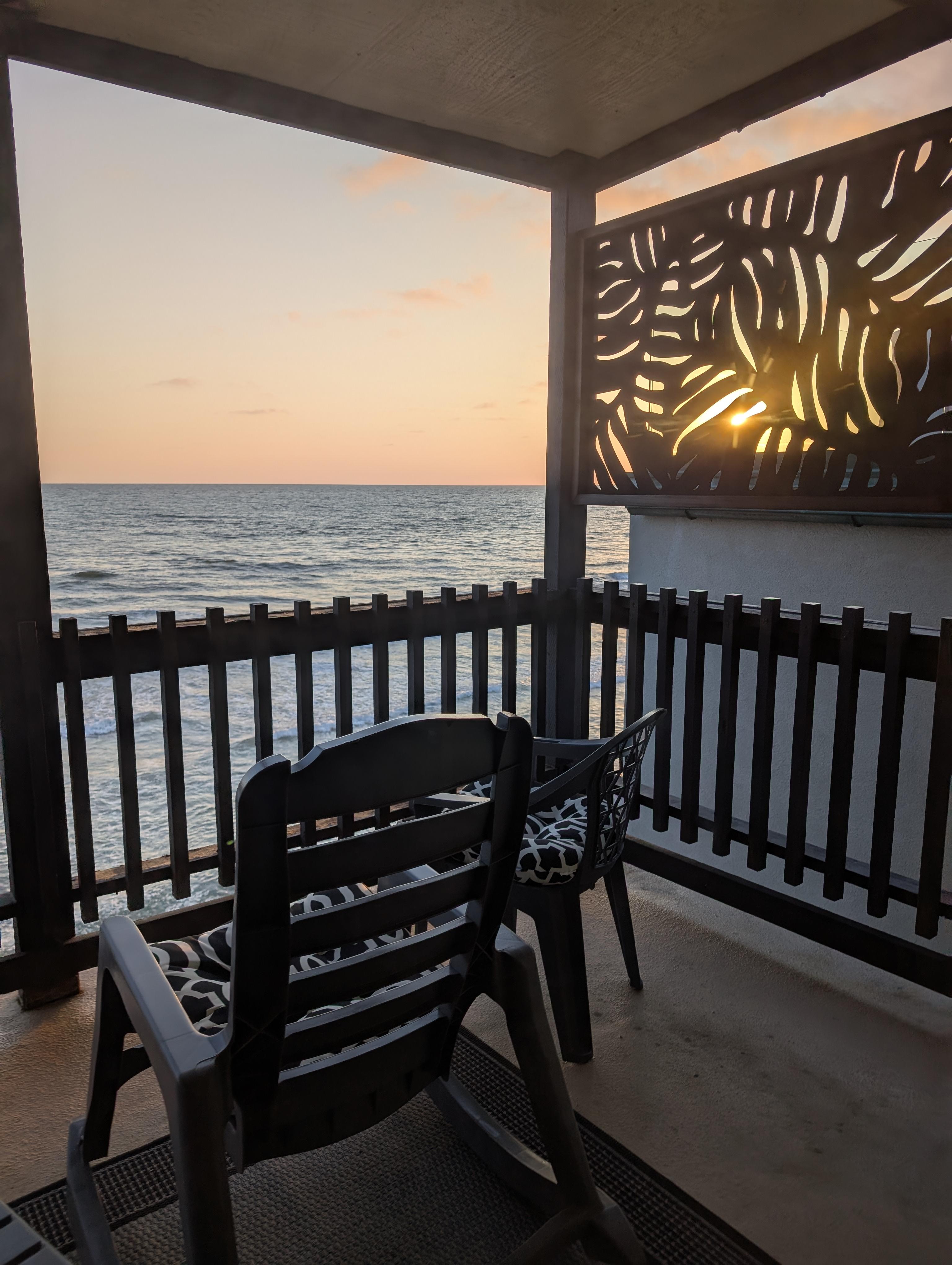 View of the sunset over the ocean from the balcony