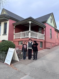 My granddaughter and her friends in front of the 1900 house.
