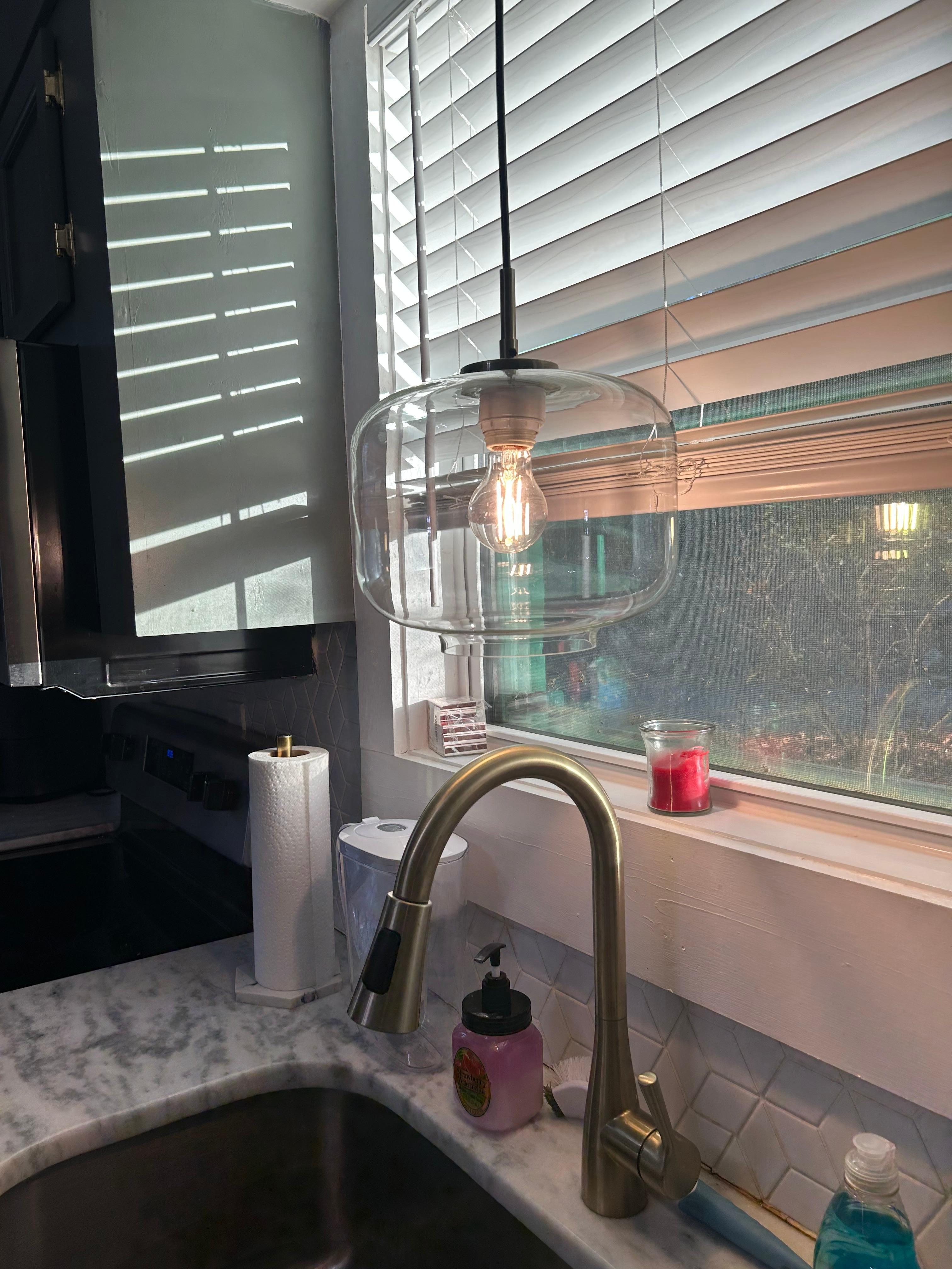 Pendant light directly above faucet