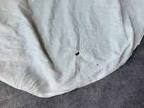 Hole in linen
