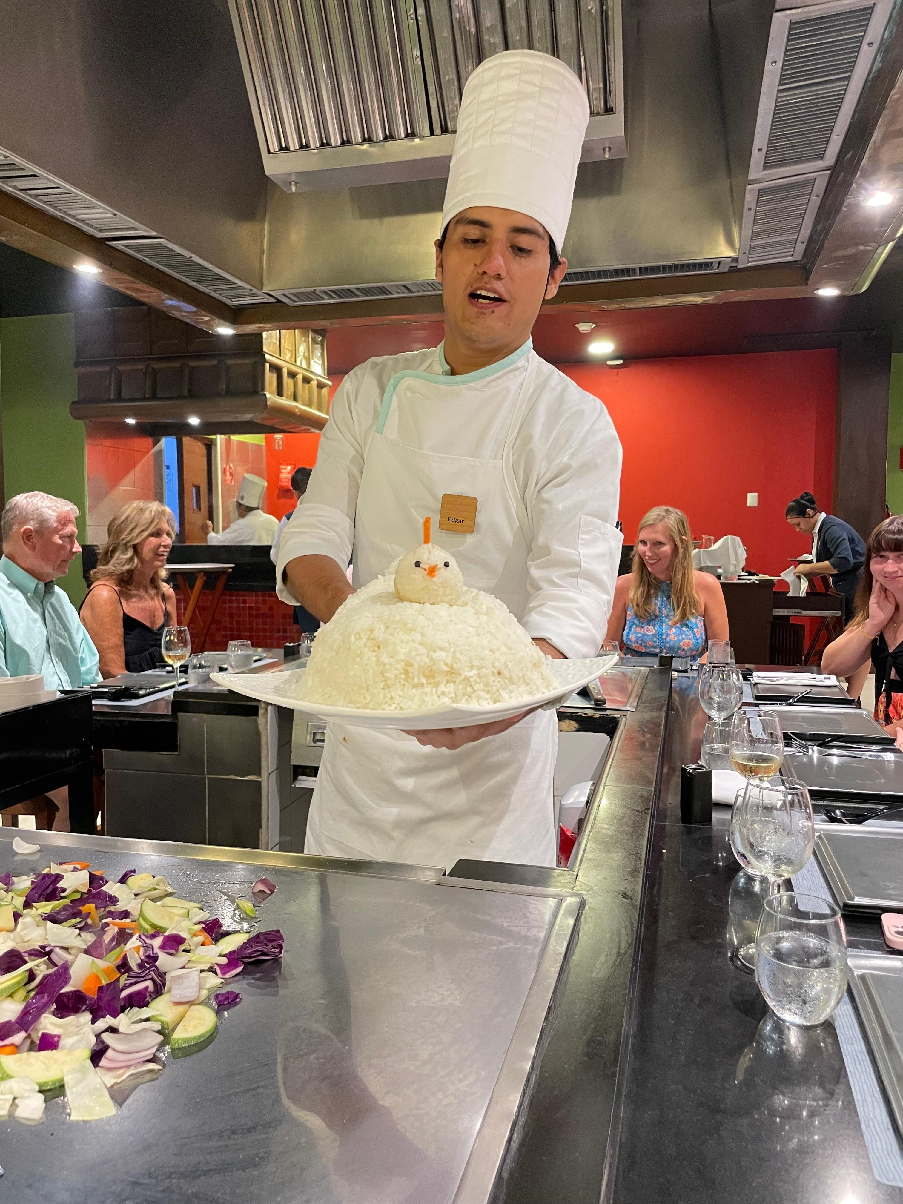 Hibachi chef with the rice chicken at the Japanese restaurant