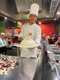 Hibachi chef with the rice chicken at the Japanese restaurant