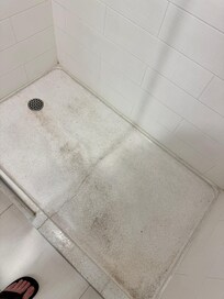 Wear and tear and crack in shower..