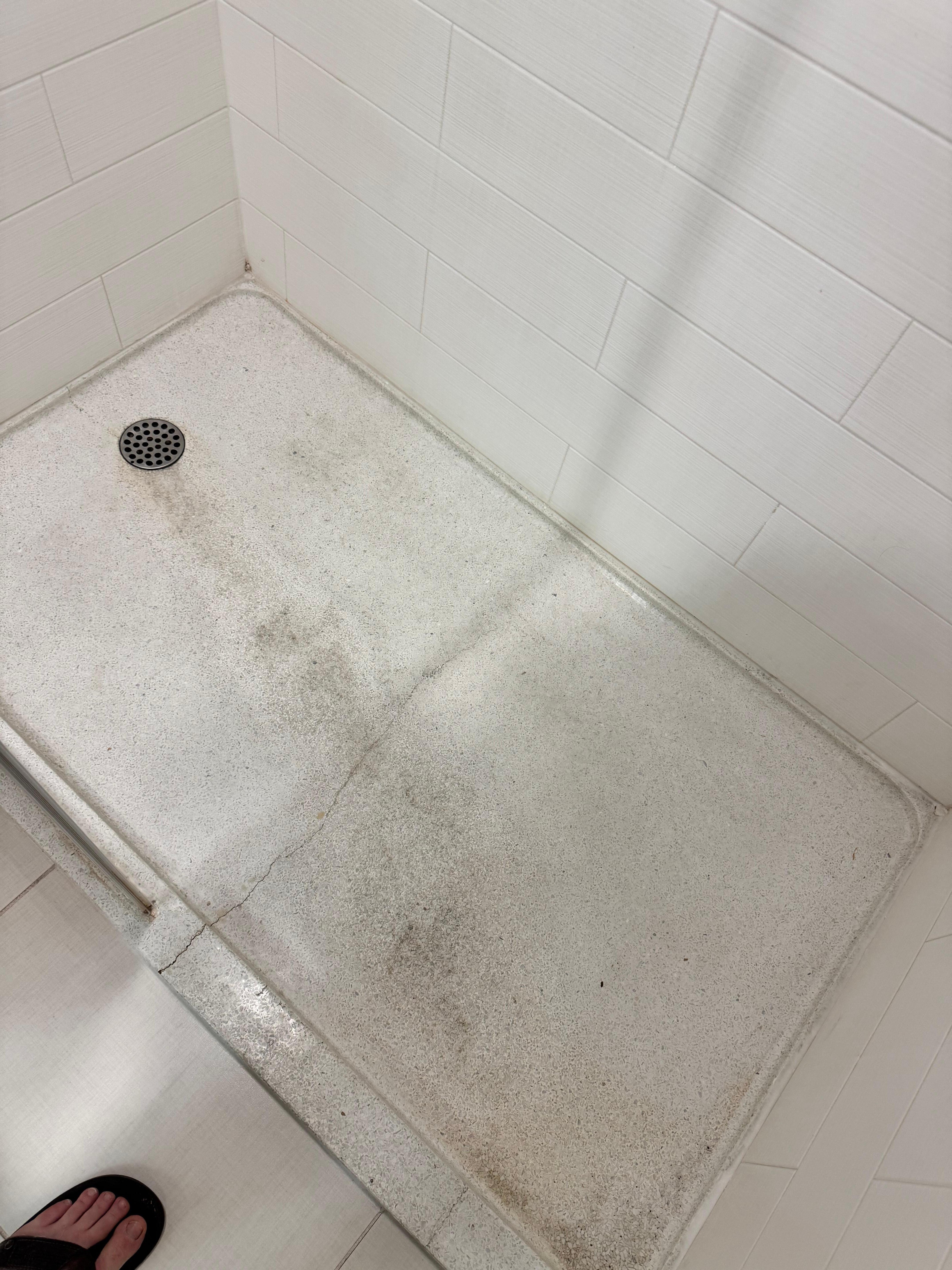 Wear and tear and crack in shower..