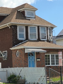 Poorly kept house across the street that shows the rundown neighborhood