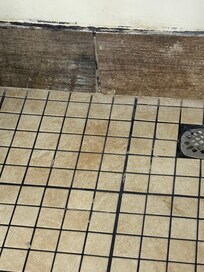 Shower floor dirty.