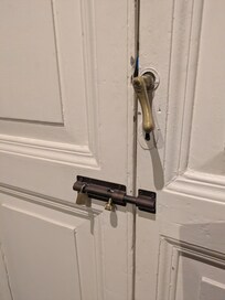 Double doors right of drafting table locked (were open in listing) - don't know what's on other side.