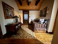 Hallway between bedrooms with day bed.