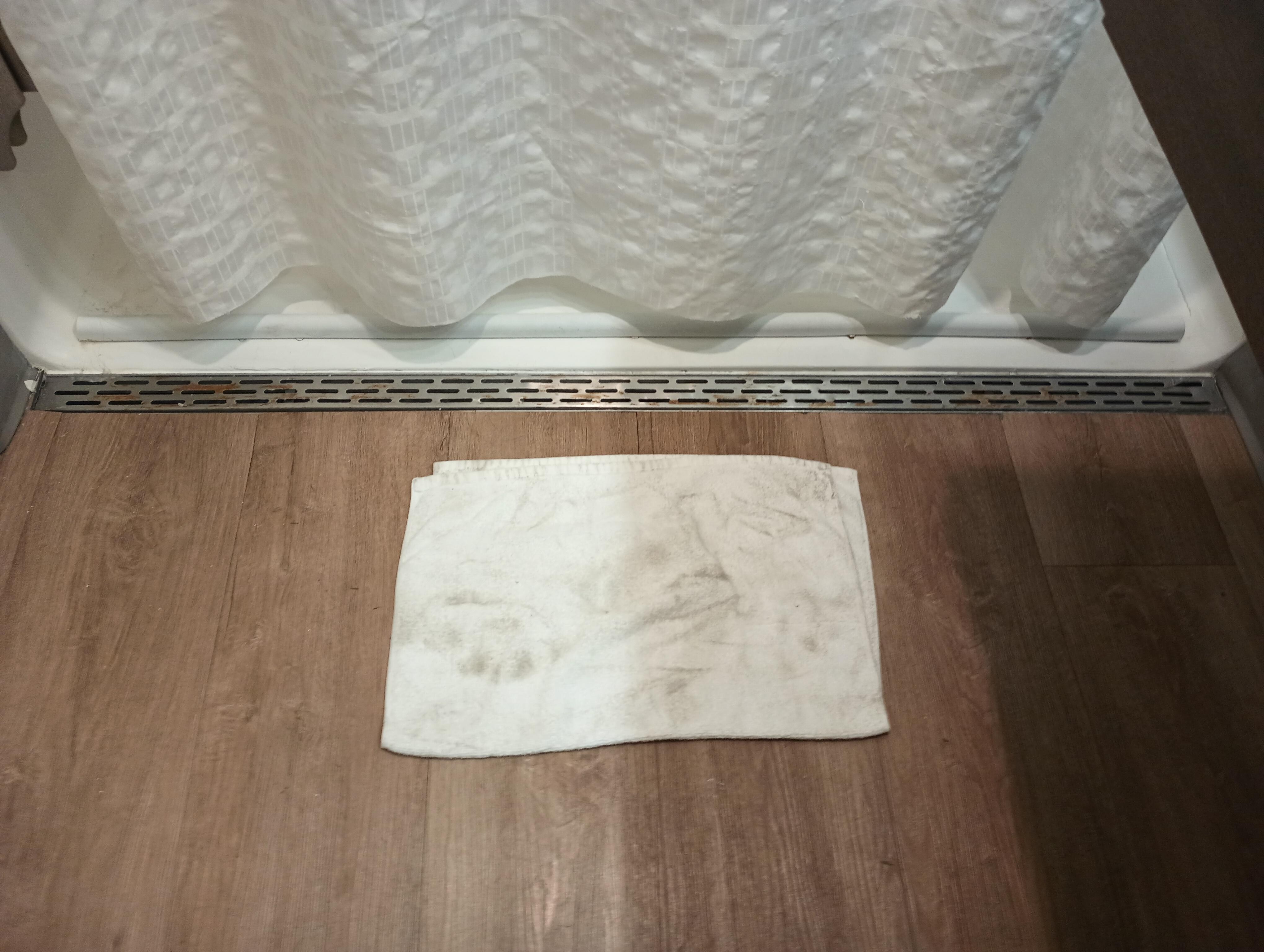 Bath mat after wiping up the floor after a shower. We got two thin towels, 2 wash clothes and a bath mat. No hand towel. Floor is so sticky with cleaning stuff (I guess) that it holds dirt. We had to keep our socks on to keep our feet clean