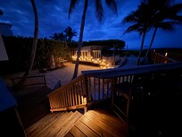 Night shot looking from house over the back courtyard and cabana.