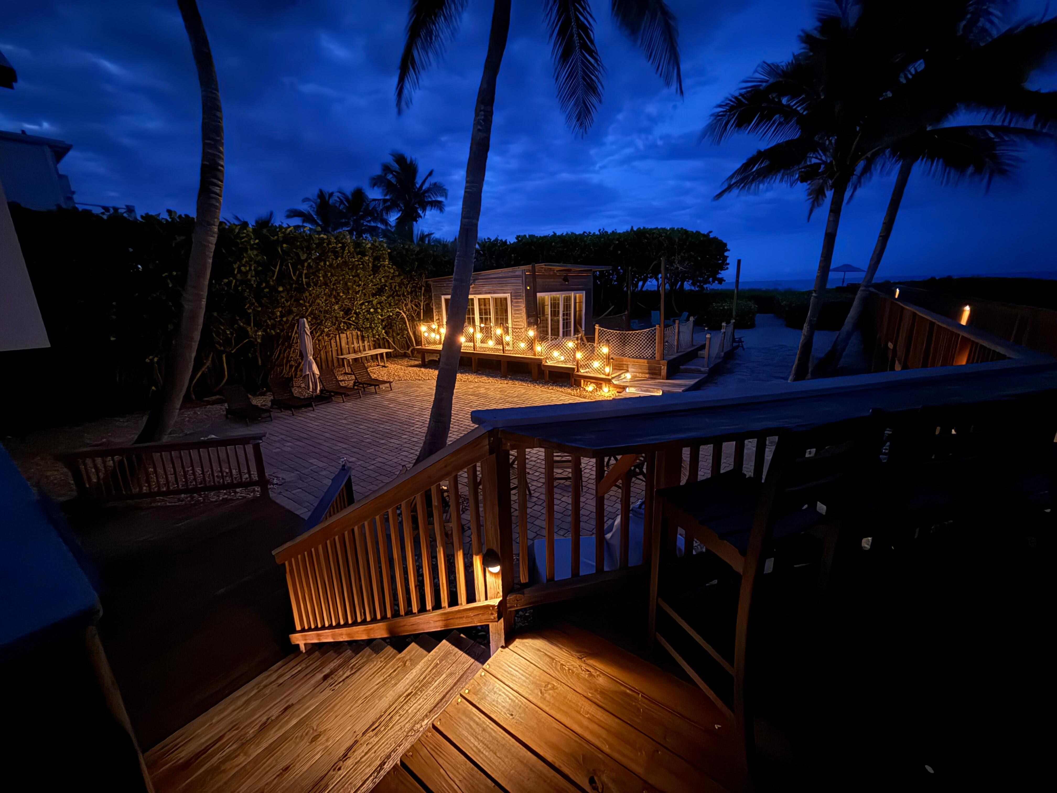 Night shot looking from house over the back courtyard and cabana. 