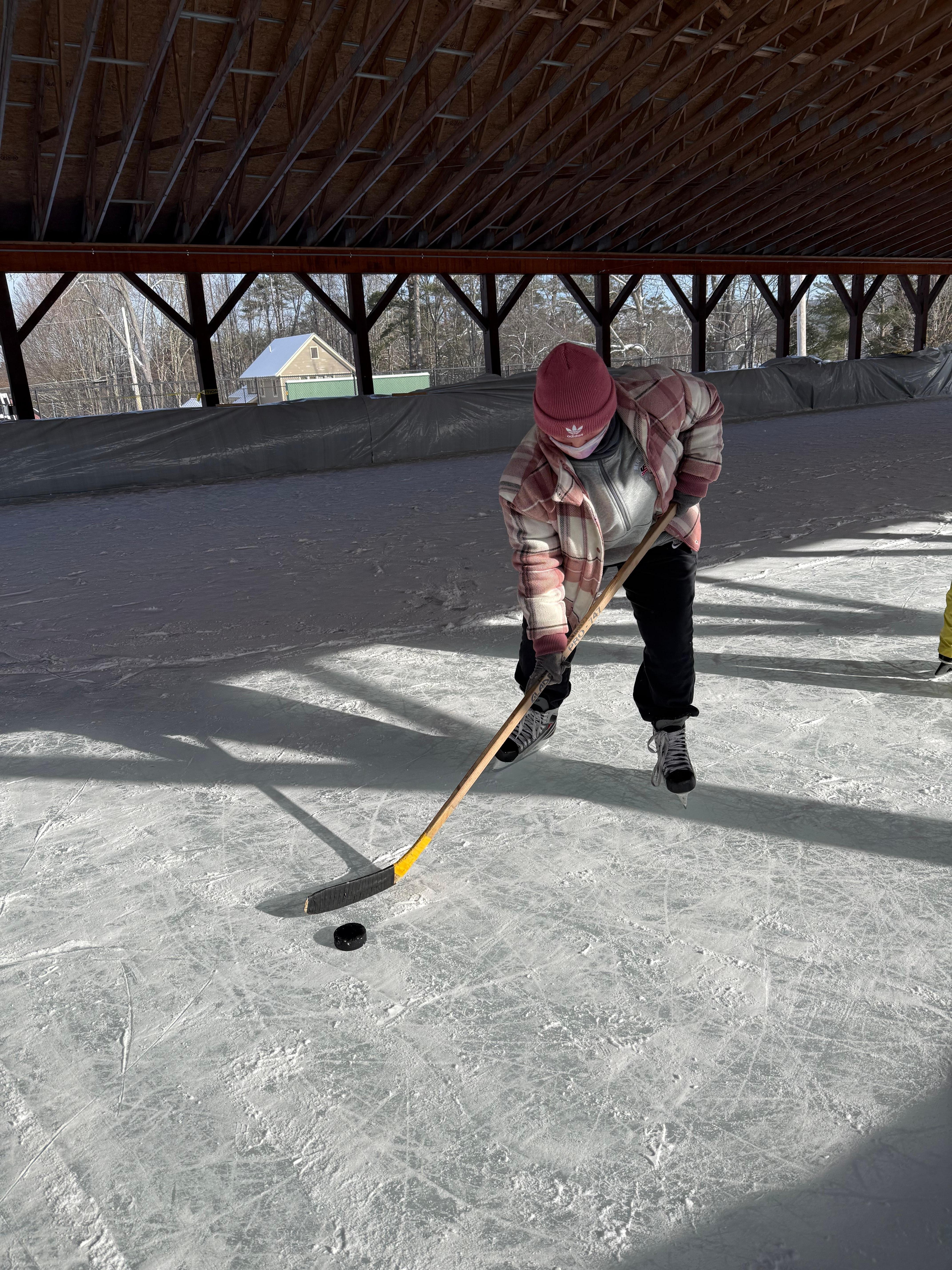 Borrowed skates and stick at the rink