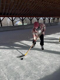 Borrowed skates and stick at the rink