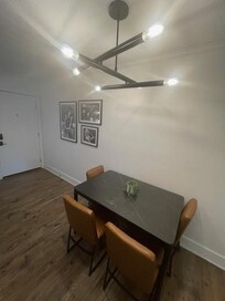 Cute little dining area with music themed artwork