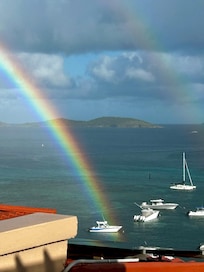 Morning rainbow landing maybe 50 yards outside our balcony