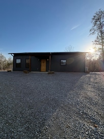 Once up the gravel hill, the first unit with fire pit & the trail to the right
