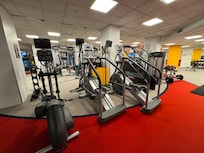 Huge workout center with dozens of machines.