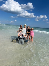 Can't let a broken foot spoil your beach fun