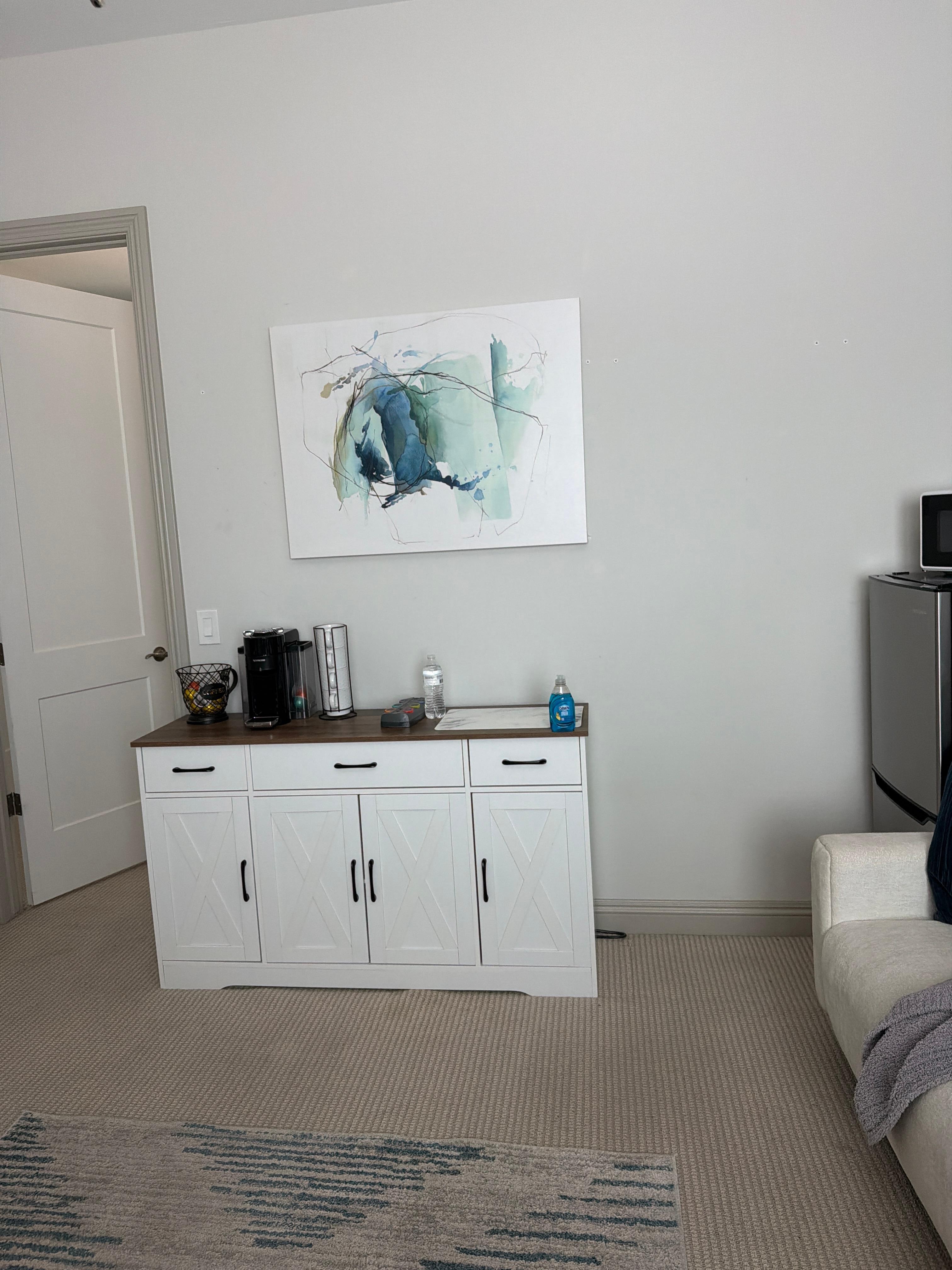 This is the kitchen area. It also has a nice refrigerator freezer microwave but no cooking. It does have a coffee pot no sugar single Colombian moved it a little bit, but it doesn’t. It looks like the back. I just moved it up against the line of the 