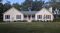 Front of house. Huge front and backyard! Great porches and plenty of parking space.