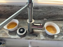 Bowls of vinegar and dish soap to catch fruit flies