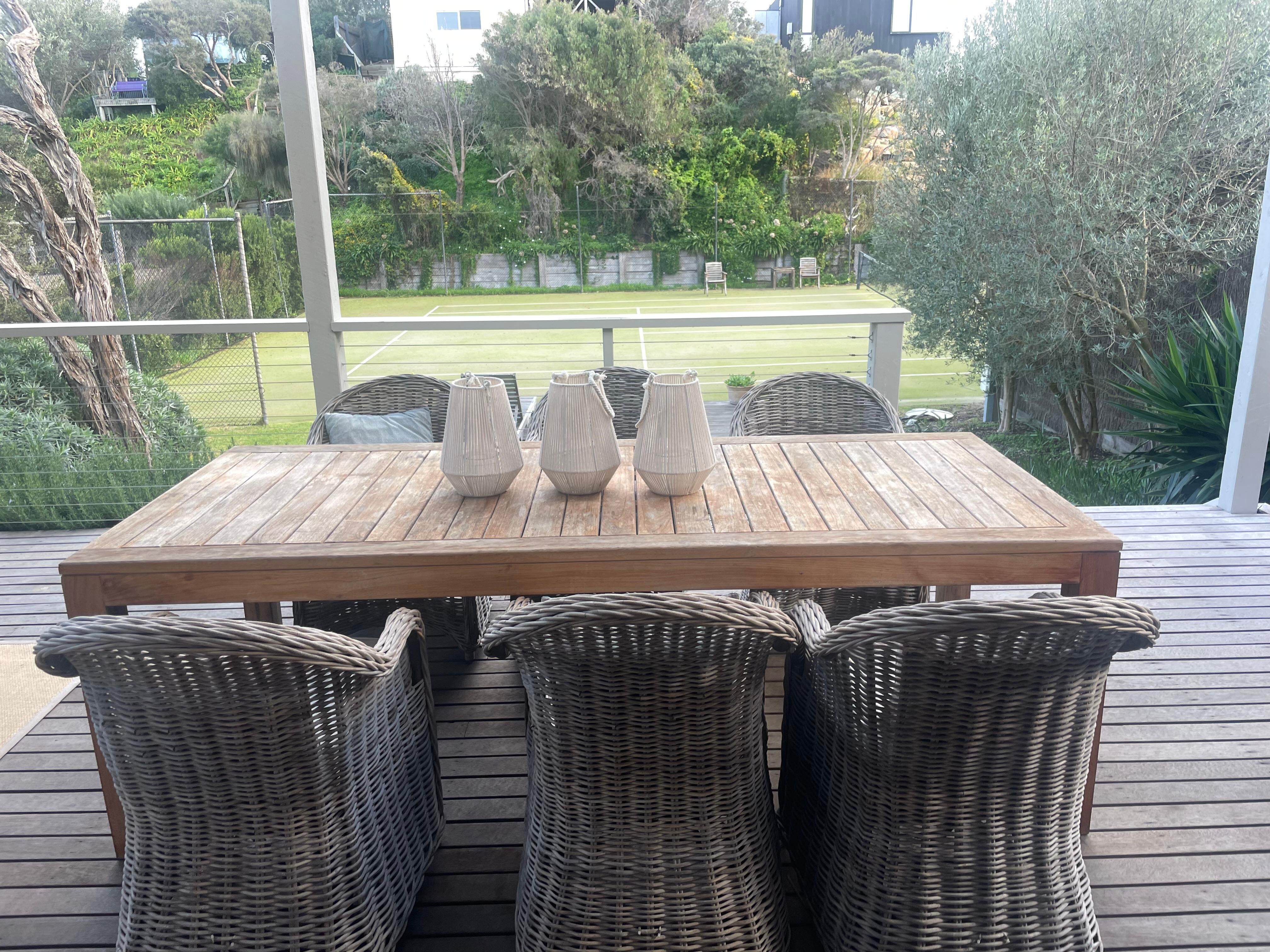 Outdoor deck and tennis court. 
