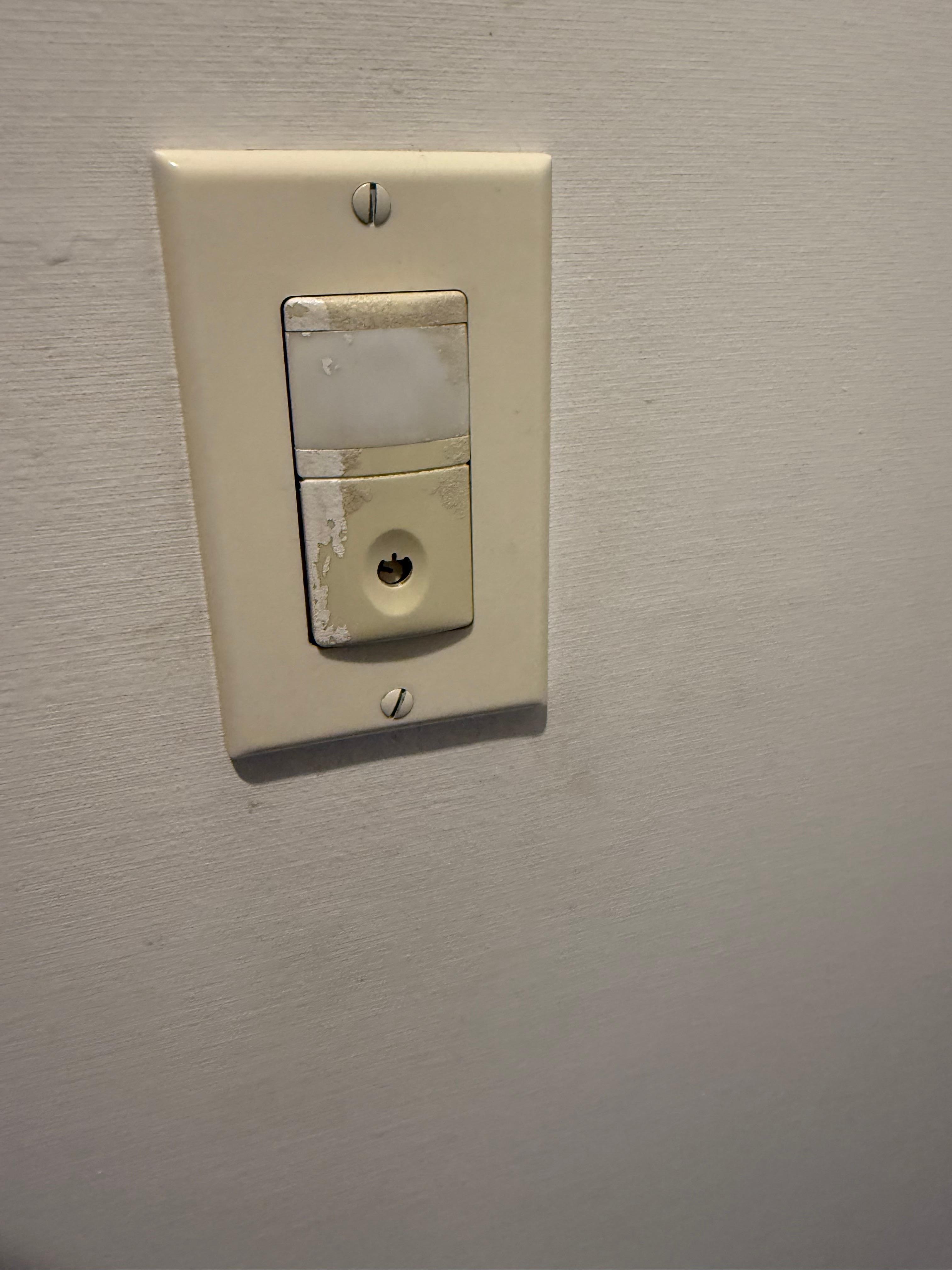 Broken filthy light switch.  