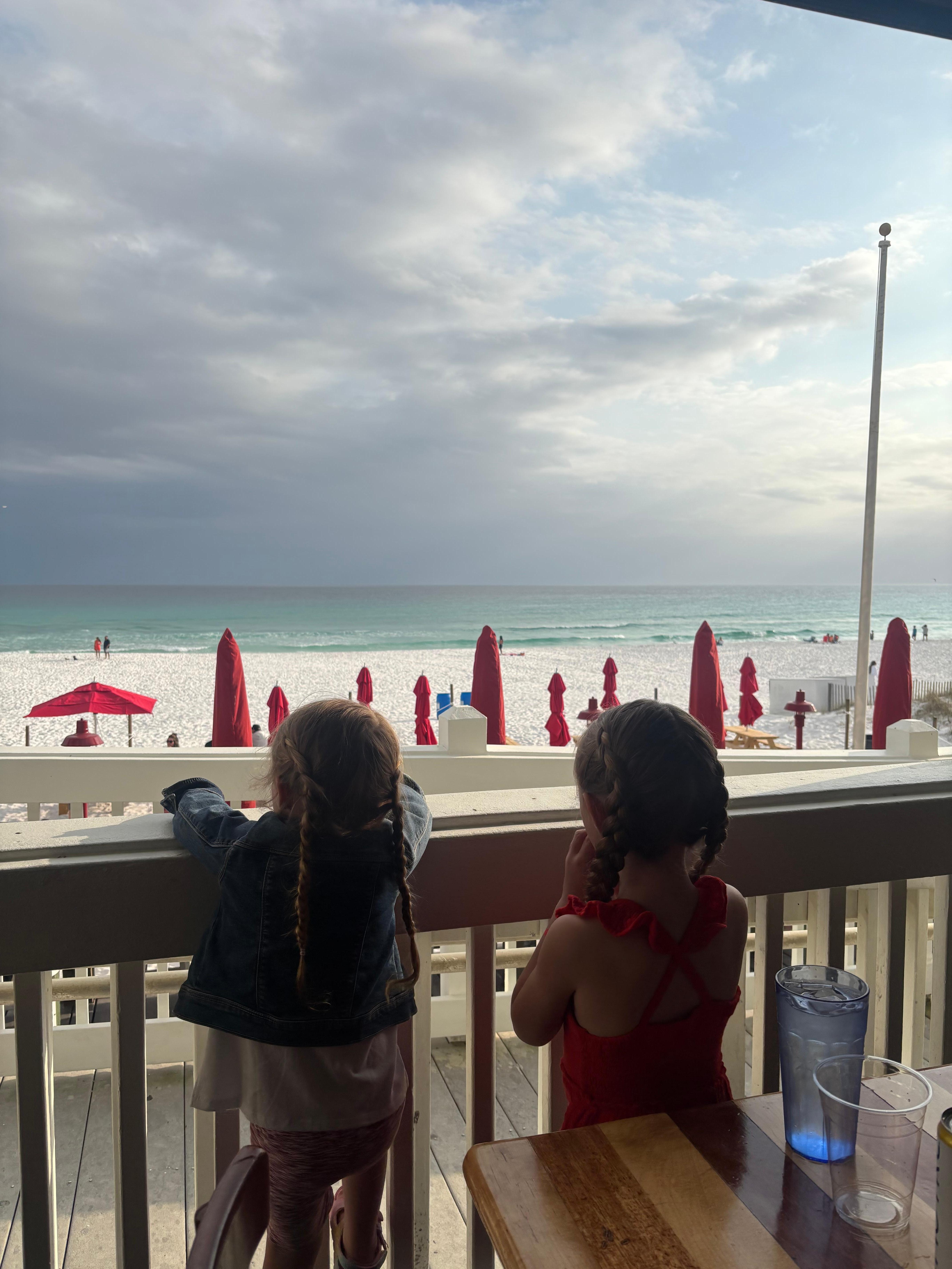 Girls looking at the beach and ocean
