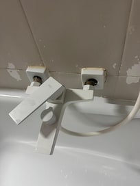 Plumbing appliances hanging off the wall.