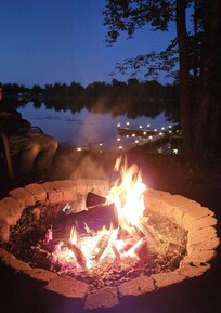 Beautiful fire pit and the solar lights on the dock make the night view amazing.