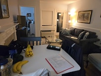 The living room with small table with chairs for 3 to eat at