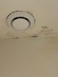 Moldy ceiling with drilling water